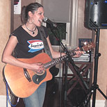Woman playing the guitar and singing